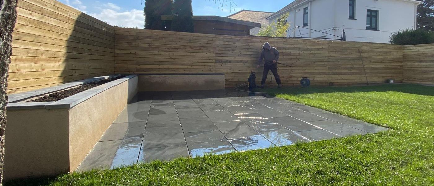 A modern stone patio installed by trusted **landscapers in Bournemouth**.